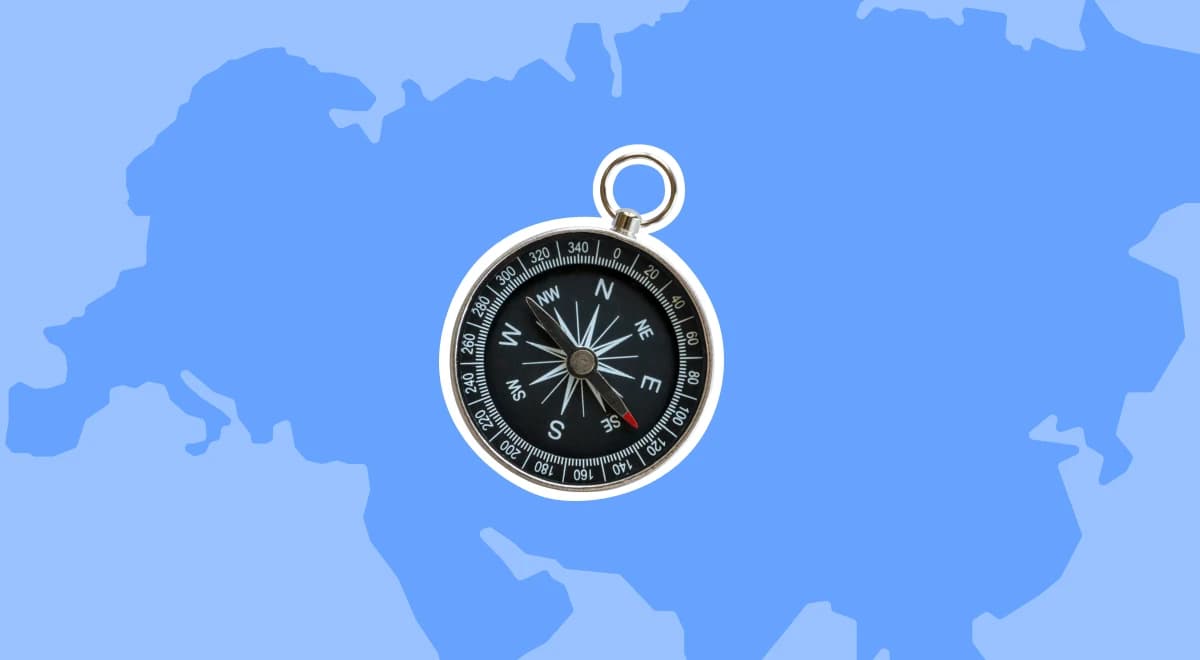 Compass placed over a blue illustrated map of Eurasia on a light blue background, representing geography trivia